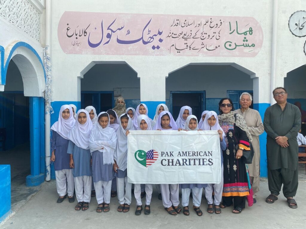 photo with a group of the baithak school students and their principal during a visit by our two board members 2023